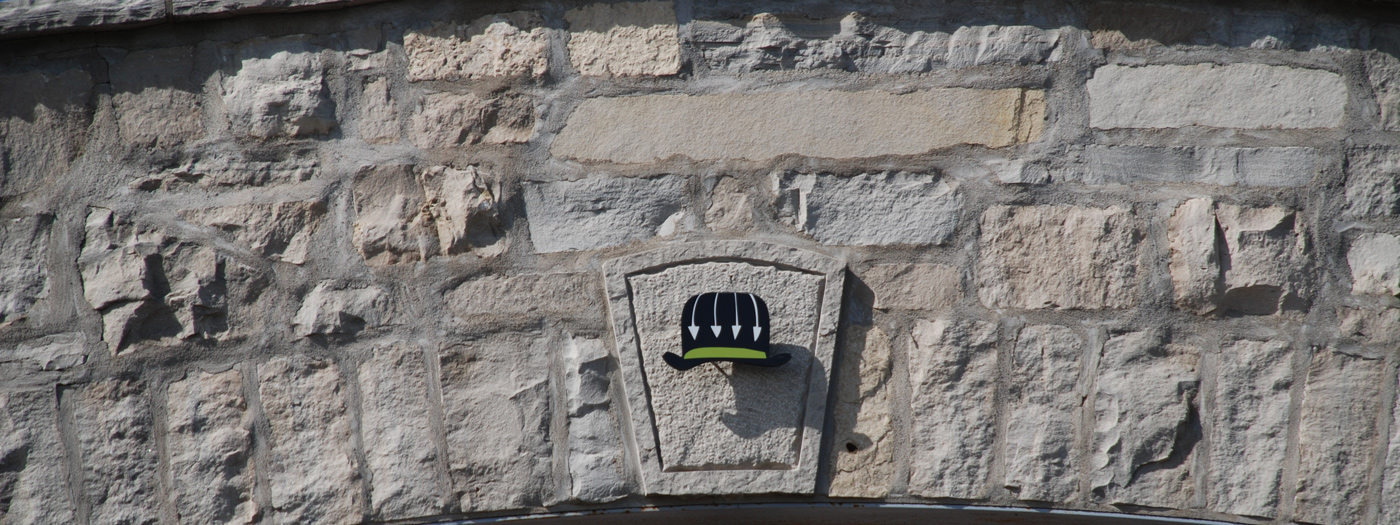 Megalomaniac Hat on the Wall